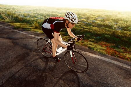 Cyclist at sunsetの写真素材