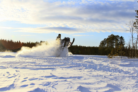 Flying high with a snowmobileの写真素材
