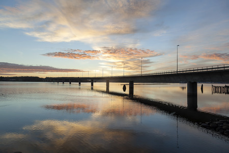 Bridge in sunrise and  reflections in the water