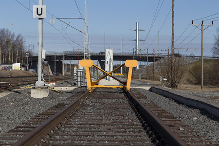 A view from a railway area and track with a stop in the end.の写真素材