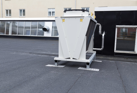 A whole ventilation system on a roof top with some pipesの写真素材