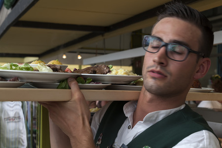 Munich - Germany, September 20, 2014: One of the waiters during Oktober fest  Oktober fest starts in...