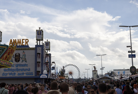 Munich - Germany September 20, 2014:  A picture of the crowd and som buildings in the Oktober fest area.  During these days there is a lot of persons visiting the area and it is very crowded  Oktober fest starts in September and the reason for that goes wのeditorial素材
