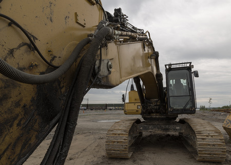 A close up on an excavator and the arm.