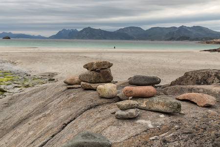 Some pebbles on a rock on a beachの写真素材