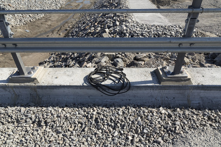 Electrical cord on a concrete part on a building siteの写真素材