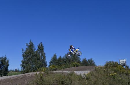 A person making a long jump on a motor cycleのeditorial素材