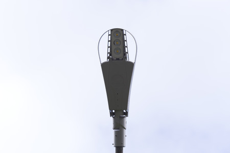 An isolated lamp post from below