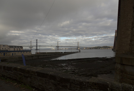 A view over a bridge and a construction crane in the background