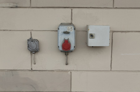 A group of power outlets on a wallの写真素材