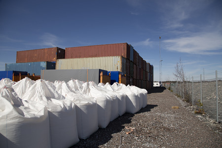A group of sacks and piled containers
