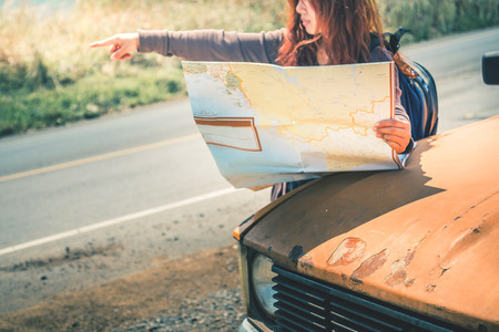 Drive old car Travel. Female travelers travel nature mountain map navigation