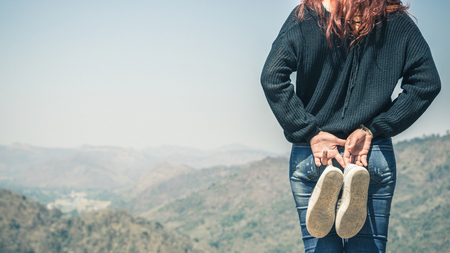 Women stand in natural surroundings, mountain forests in hand.の写真素材