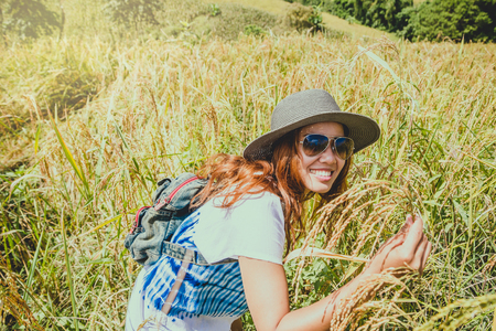 Asian women travel relax in the holiday. Stand natural touch mountain field. Thailandの写真素材