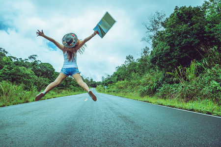 Asian women travel relax in the holiday. Jump on the road
Natural route. Thailandの写真素材