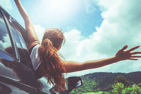 Asian women travel relax in the holiday. driving a car traveling happily.の写真素材