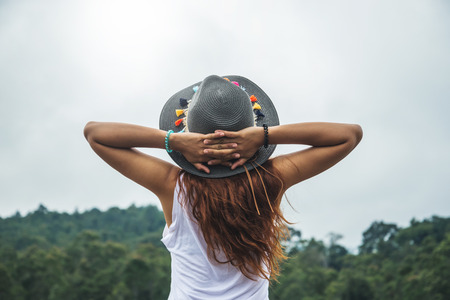 Asian women relax in the holiday. In the natural atmosphere, mountain forest.の写真素材