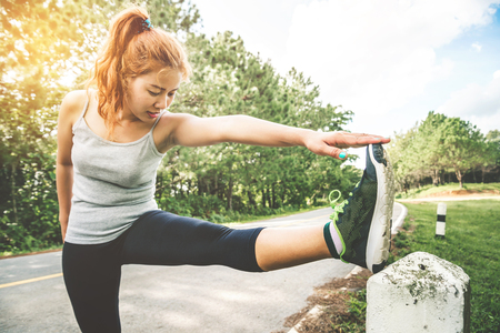 Women exercise on the street. Nature park. Asian womenの写真素材