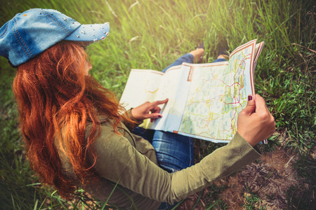 woman  travel. Asian women view map travel nature on the meadow