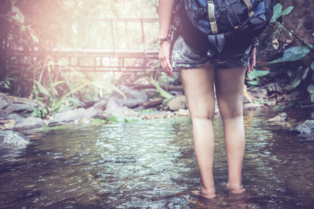 woman travelers travel nature Forests, relax play waterfallの写真素材