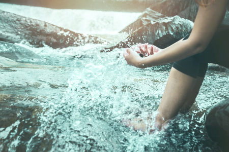 woman travelers travel nature Forests, relax play waterfallの写真素材