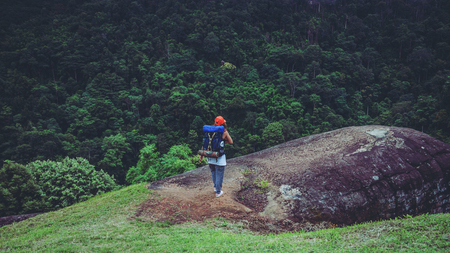 Asian women travel relax in the holiday. Standing on the mountain. Thailandの写真素材