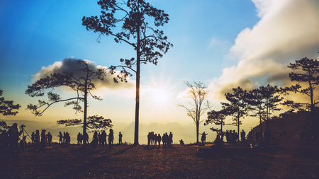 People watching Sunrise in the morning. Tourists travel relax in the holiday. photograph sunrise in...