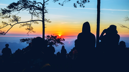 People watching Sunrise in the morning. Tourists travel relax in the holiday. photograph sunrise in the morning among people. Thailandの写真素材