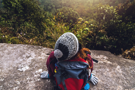 women asians travel relax in the holiday. Admire the atmosphere landscape on the Moutain. Mountain Park happily. In Thailandの写真素材