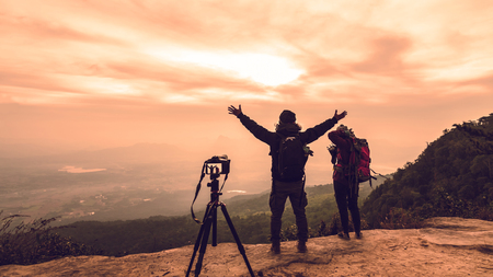 Photographer lover women and men asians travel relax in the holiday. Photograph mountain landscapes atmosphere in the morning. In the winter. In Thailandの写真素材