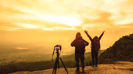 Photographer lover women and men asians travel relax in the holiday. Photograph mountain landscapes atmosphere in the morning. In the winter. In Thailandの写真素材