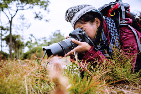Photographer asian women Traveling photograph Nature. travel relax in the holiday walk in the forest. travel relax in the holiday.  Thailandの写真素材