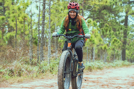  Asian women Travel photograph Nature. Travel relax ride a bike Wilderness in the wild. Thailand の写真素材
