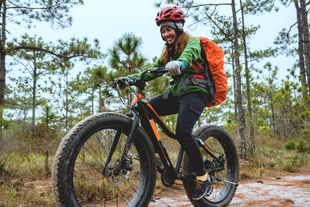  Asian women Travel photograph Nature. Travel relax ride a bike Wilderness in the wild. Thailand の写真素材