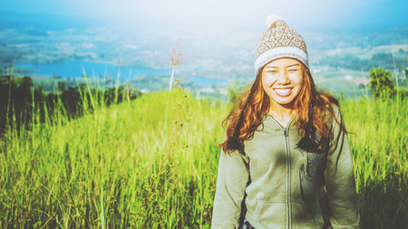 Asian woman travel relax camping in the holiday. green pasture on the Mountain in summer. Thailandの写真素材