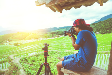 man asians travel nature. Travel relax. Take a photo at the front terrace. in summer.の写真素材