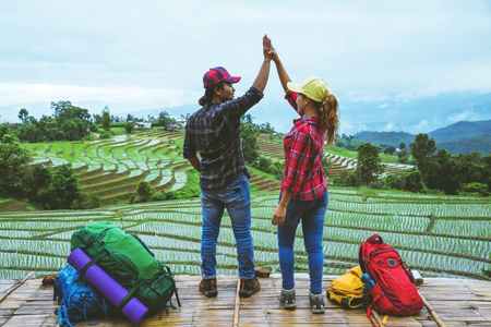 Lover woman and man Asian travel nature. Travel relax. Viewpoint Rice field of the field on the Moutain papongpieng in summer. Thailandの写真素材