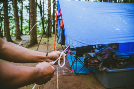 Travel nature relax in the holiday. camping on the moutainIn the wild nature. Pull the rope...