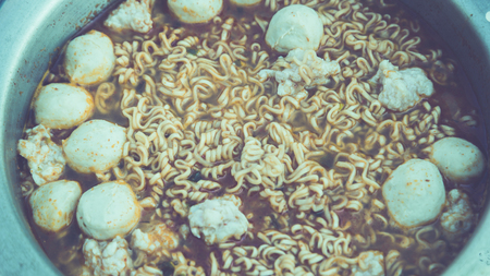 Boil the noodles with eggs and meatballs.の写真素材