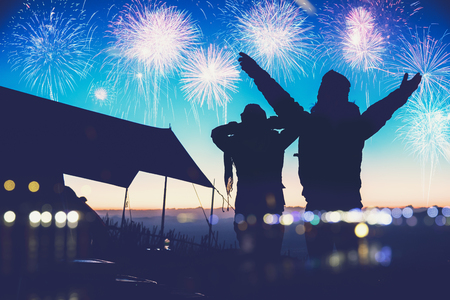 Lover women and men asians.camping on the Mountain see the fireworks on New Year's Day. Thailandの写真素材