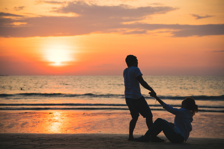 Asian lovers happy and having fun holding hands. Travel beach summer vacation.の写真素材