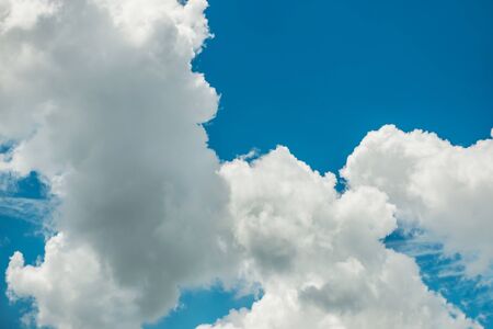 Fantastic soft white clouds against blue sky background