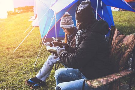 Lover women and men asians travel relax camping in the holiday. Camping In the winter.Read books, drink coffee. Thailandの写真素材