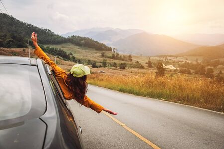 Asian women travel relax in the holiday. driving a car traveling happily.