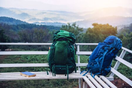 The backpack is placed at the viewpoint on the mountain, the of ââfog. Nature photography tourの写真素材