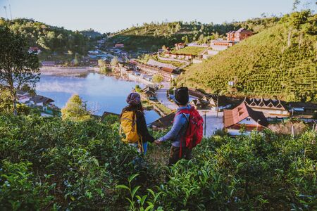 Couple Asian traveling in Ban Rak Thai village countryside. Travel, camping in the winter, Outdoor relaxation, Romantic couples.の写真素材