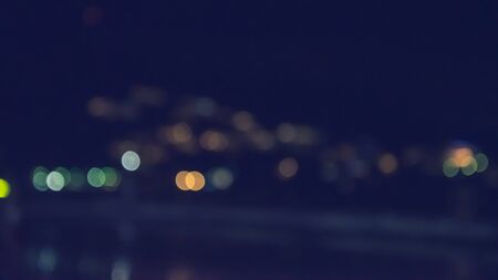 Vintage color tones are abstract, blurred images of the shops selling goods by the beach at night...