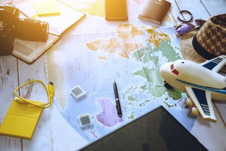 Vacation travel planning concept travel around the world with maps. of Side view equipment for travelers. summer, Travel, map. concept background, Travel, a plane, passport, tourism concept.の写真素材
