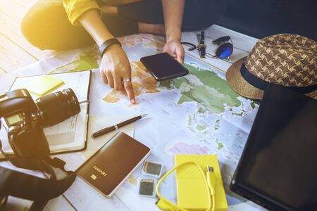 Vacation travel planning concept with map. Overhead view of equipment for travelers. Travel concept...
