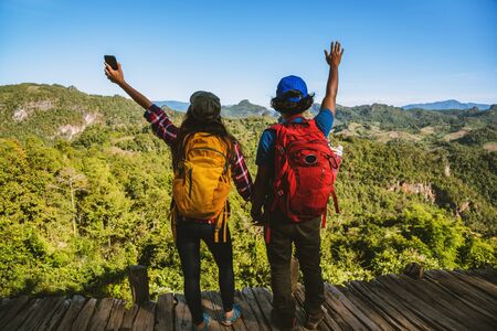Travel, nature travel of Asian couples while is relaxing outdoors during his trip in Thailand.の写真素材